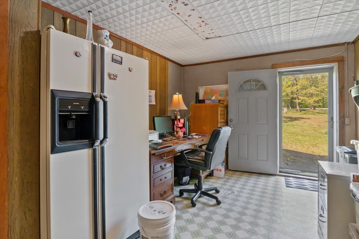 48 Hill Road Big Sandy, TN 38221 - Photo 26 of 54 a view of a workspace with furniture and a window