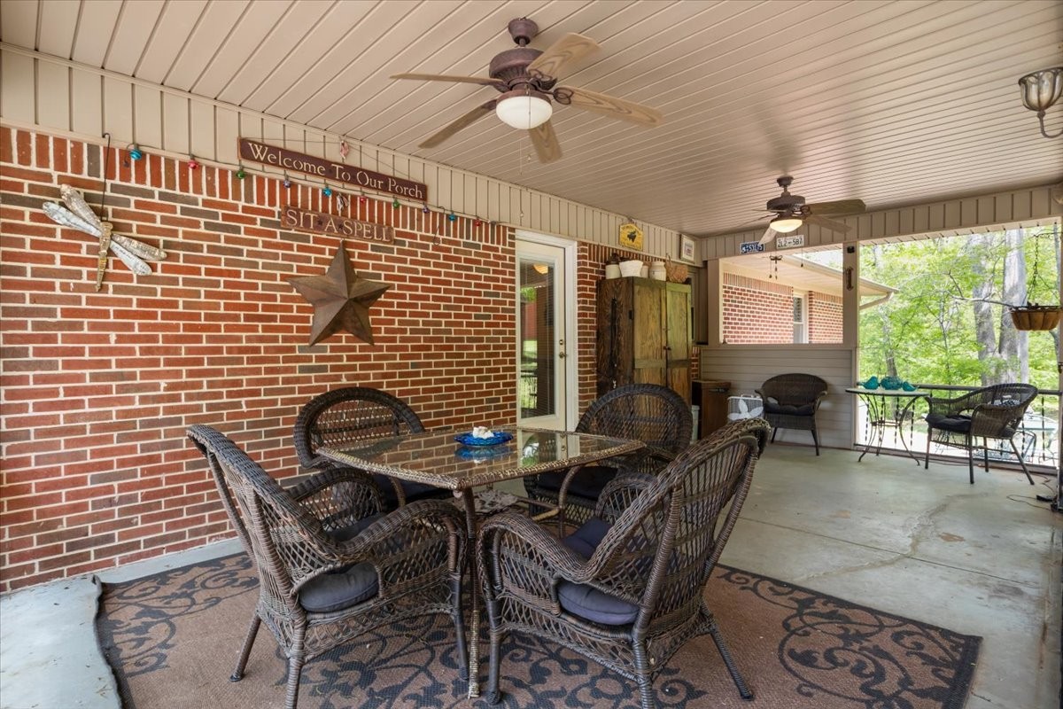 48 Hill Road Big Sandy, TN 38221 - Photo 29 of 54 a view of a dining room with furniture window and outside view