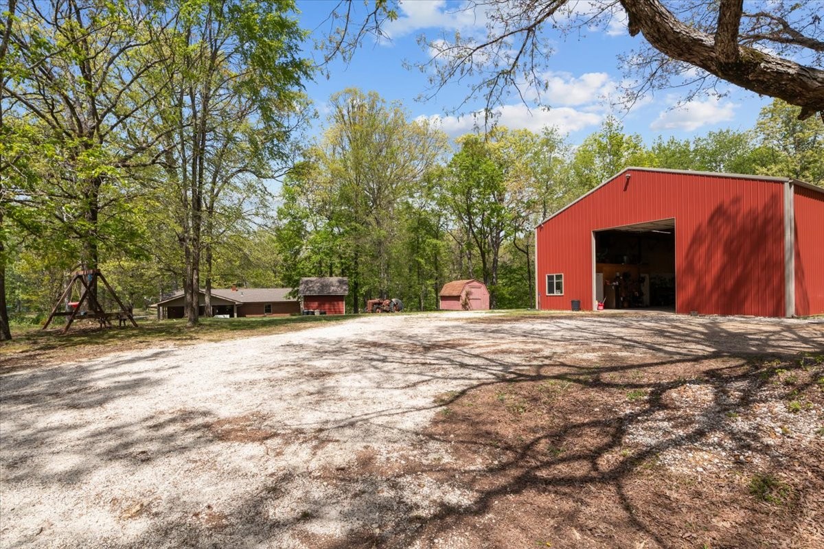 48 Hill Road Big Sandy, TN 38221 - Photo 33 of 54 a view of outdoor space yard and basketball court