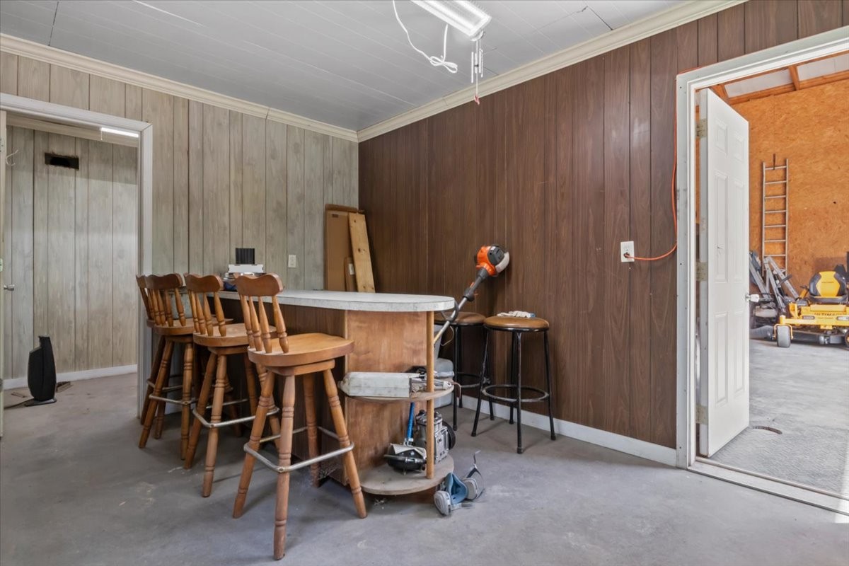 48 Hill Road Big Sandy, TN 38221 - Photo 37 of 54 a view of a dining room with furniture and a chandelier