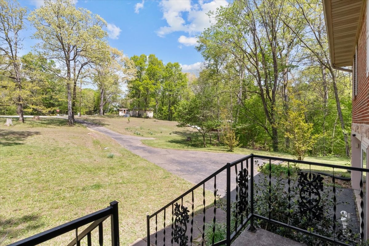 48 Hill Road Big Sandy, TN 38221 - Photo 4 of 54 a view of a balcony with trees