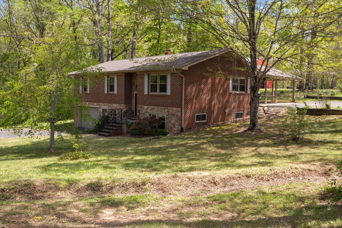 48 Hill Road Big Sandy, TN 38221 - Photo 41 of 54 a view of a house with a yard