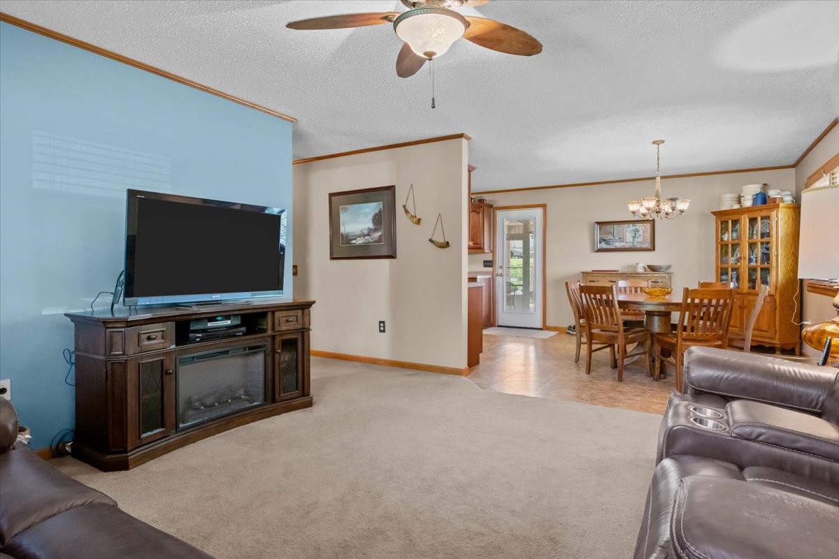 48 Hill Road Big Sandy, TN 38221 - Photo 5 of 54 a living room with furniture and a flat screen tv