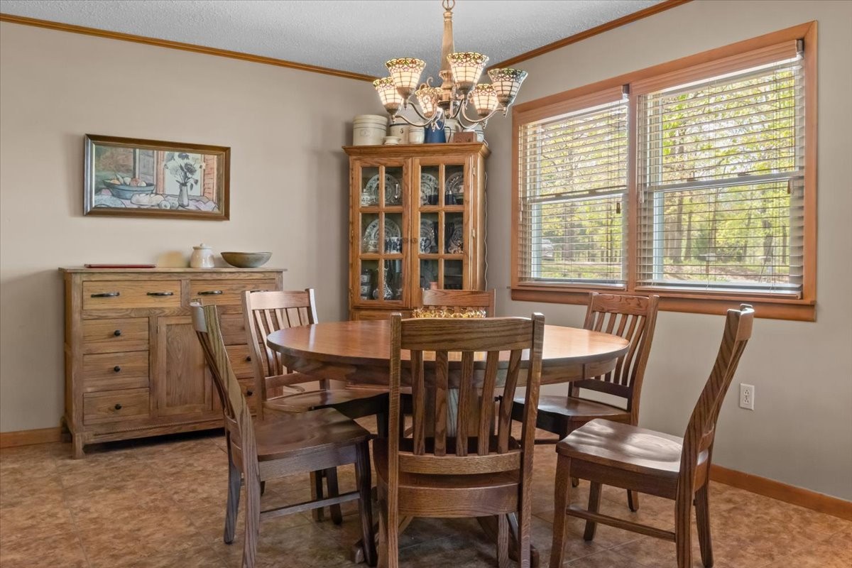 48 Hill Road Big Sandy, TN 38221 - Photo 8 of 54 a view of a dining room with furniture and chandelier