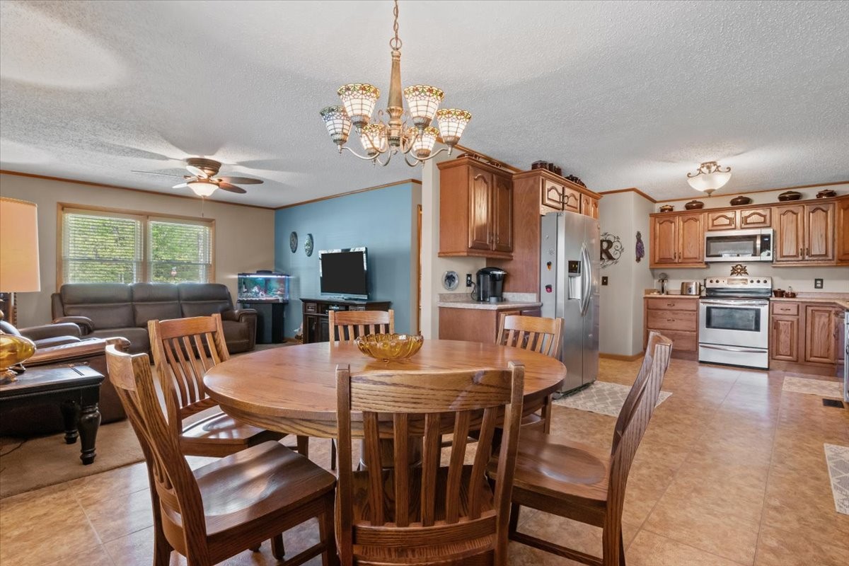 48 Hill Road Big Sandy, TN 38221 - Photo 9 of 54 a view of a dining room with furniture window and outside view