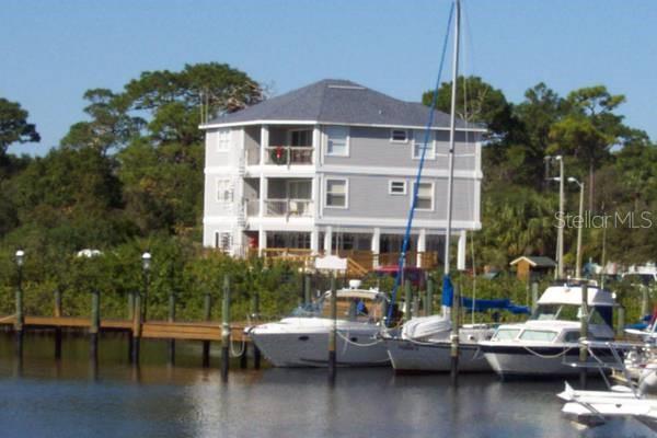 331 Anclote Road, Unit 102 Tarpon Springs, FL 34689 - Photo 1 of 1 a view of a lake with boats