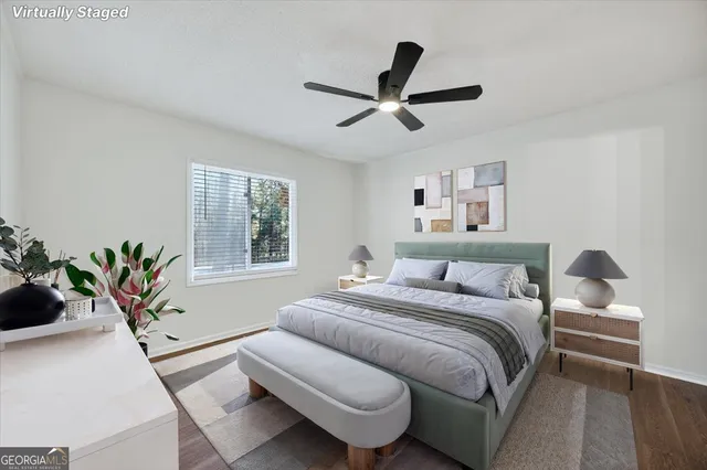 a bedroom with a large bed and a window