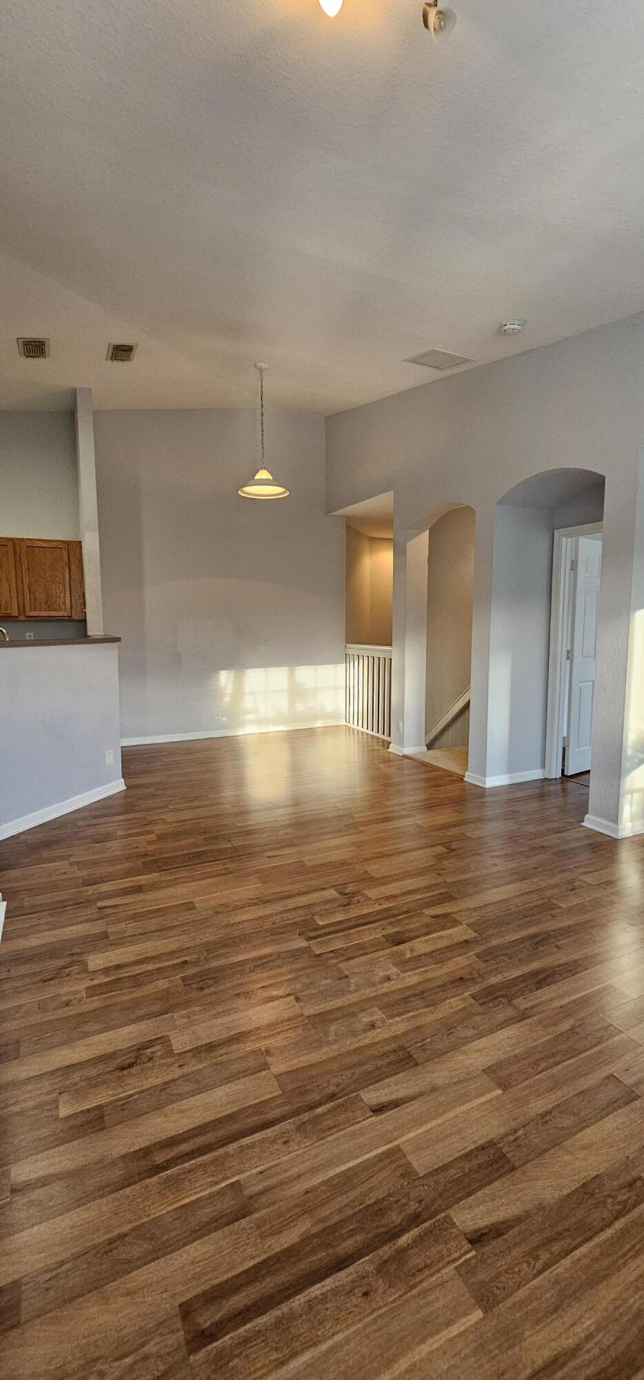 3078 Laurel Ridge Circle Riviera Beach, FL 33404 - Photo 4 of 13 a view of empty room with wooden floor