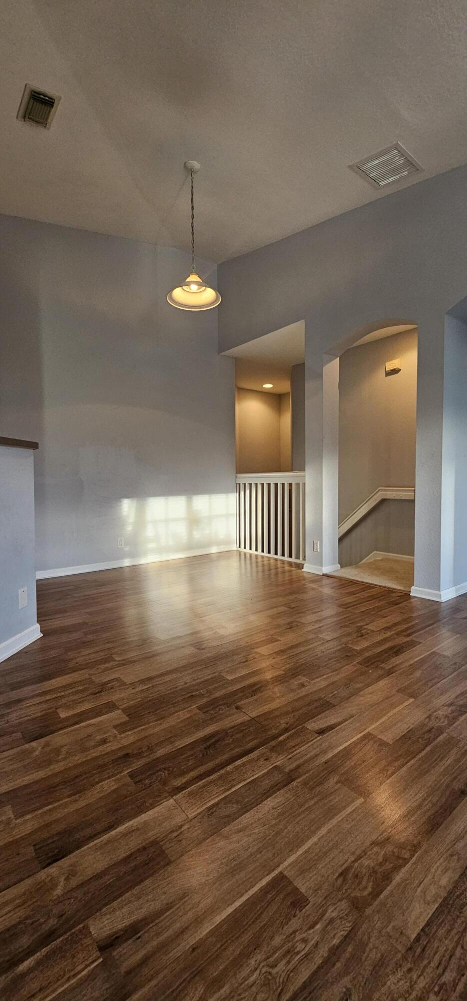3078 Laurel Ridge Circle Riviera Beach, FL 33404 - Photo 5 of 13 a view of empty room with wooden floor