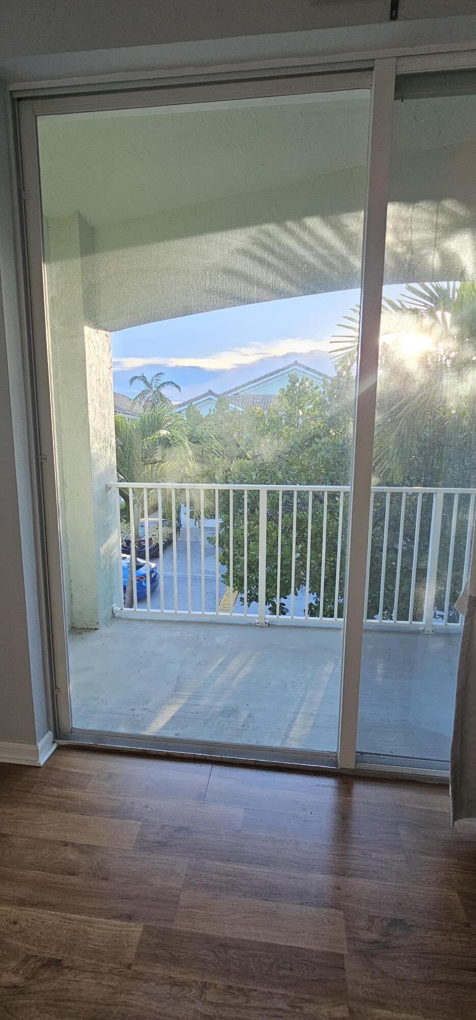 3078 Laurel Ridge Circle Riviera Beach, FL 33404 - Photo 10 of 13 a view of balcony with wooden floor
