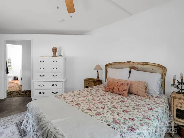 a bedroom with a bed and a closet