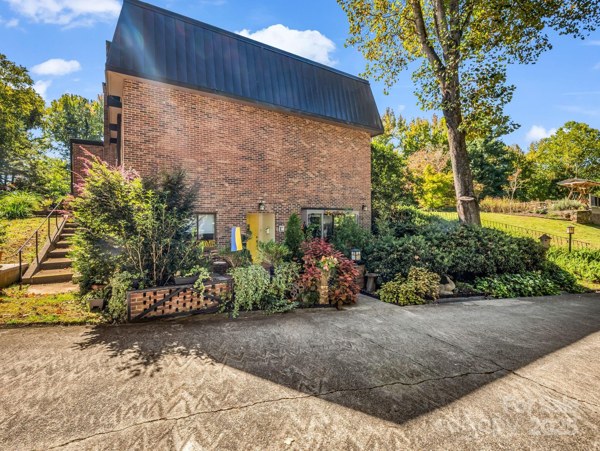 305 Grady Avenue Tryon, NC 28782 - Photo 24 of 24 a view of a garden with plants