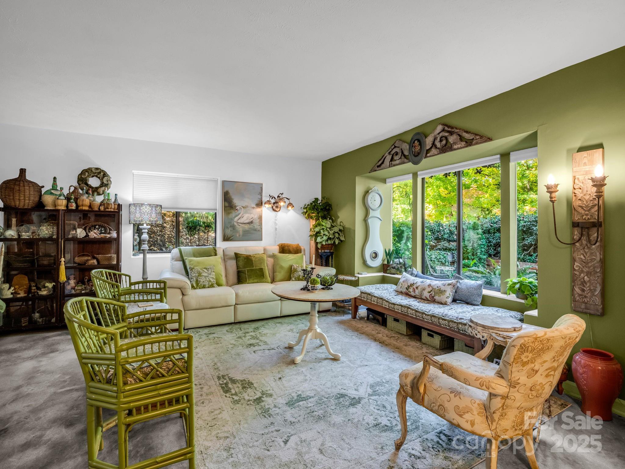 305 Grady Avenue Tryon, NC 28782 - Photo 6 of 24 a living room with furniture and a floor to ceiling window