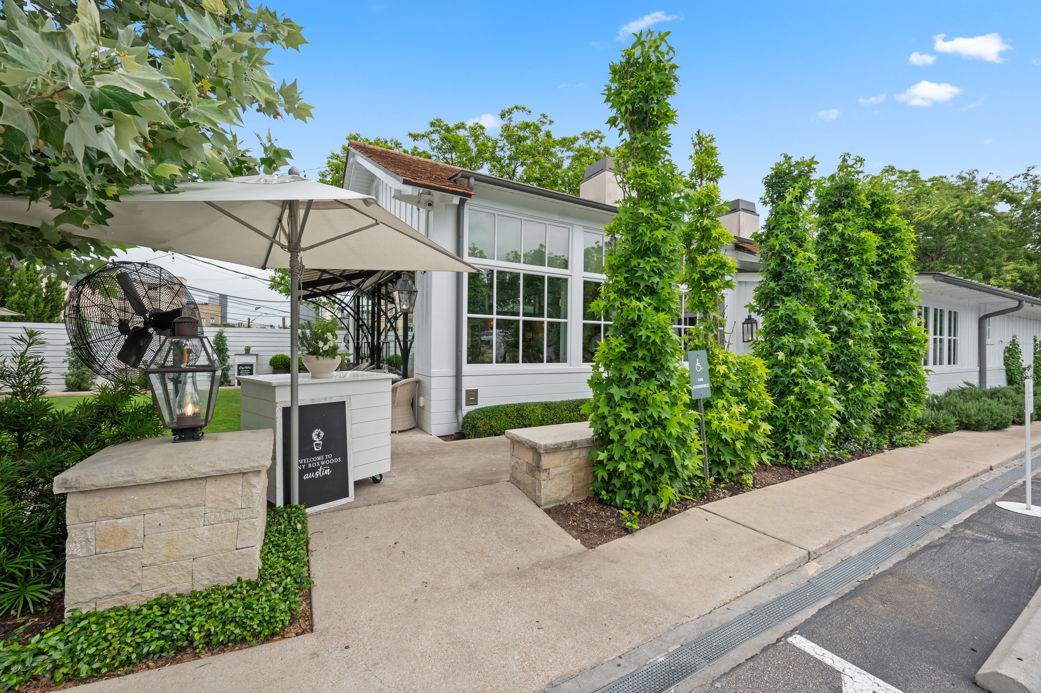 3907 Bailey Lane Austin, TX 78756 - Photo 37 of 40 Indulge in the sophisticated charm of Tiny Boxwoods, where manicured garden views meet an iconic menu