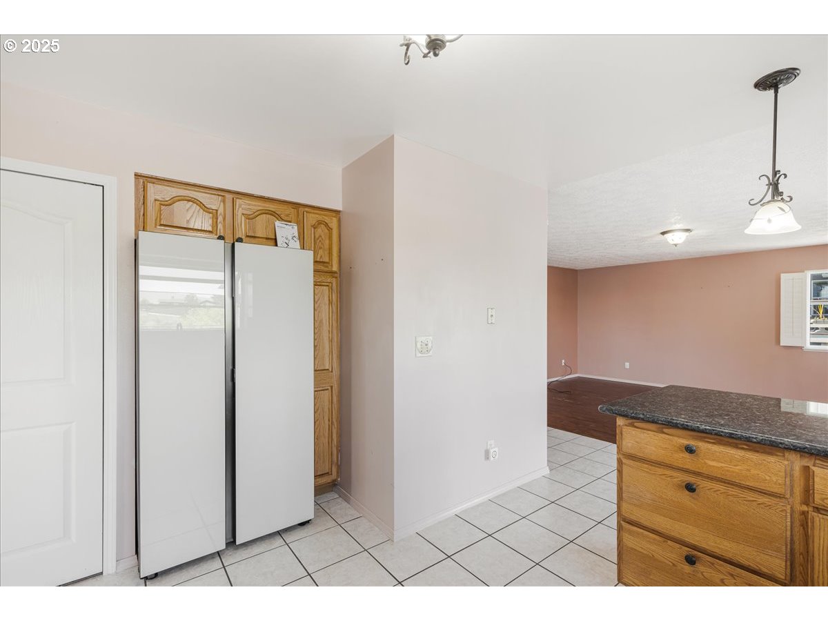 1825 Minnesota Street The Dalles, OR 97058 - Photo 12 of 47 a view of cabinets and wooden floor