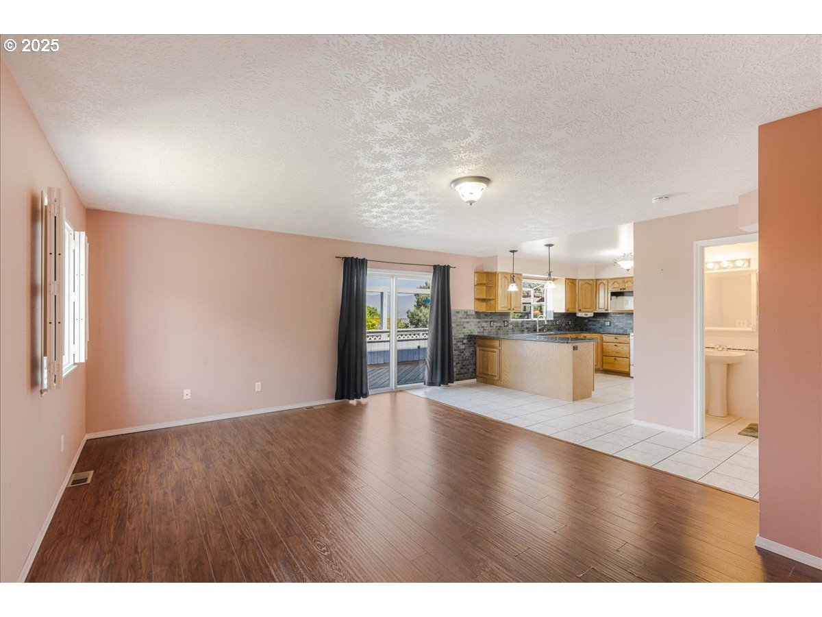 1825 Minnesota Street The Dalles, OR 97058 - Photo 16 of 47 a view of a kitchen with a sink and a window
