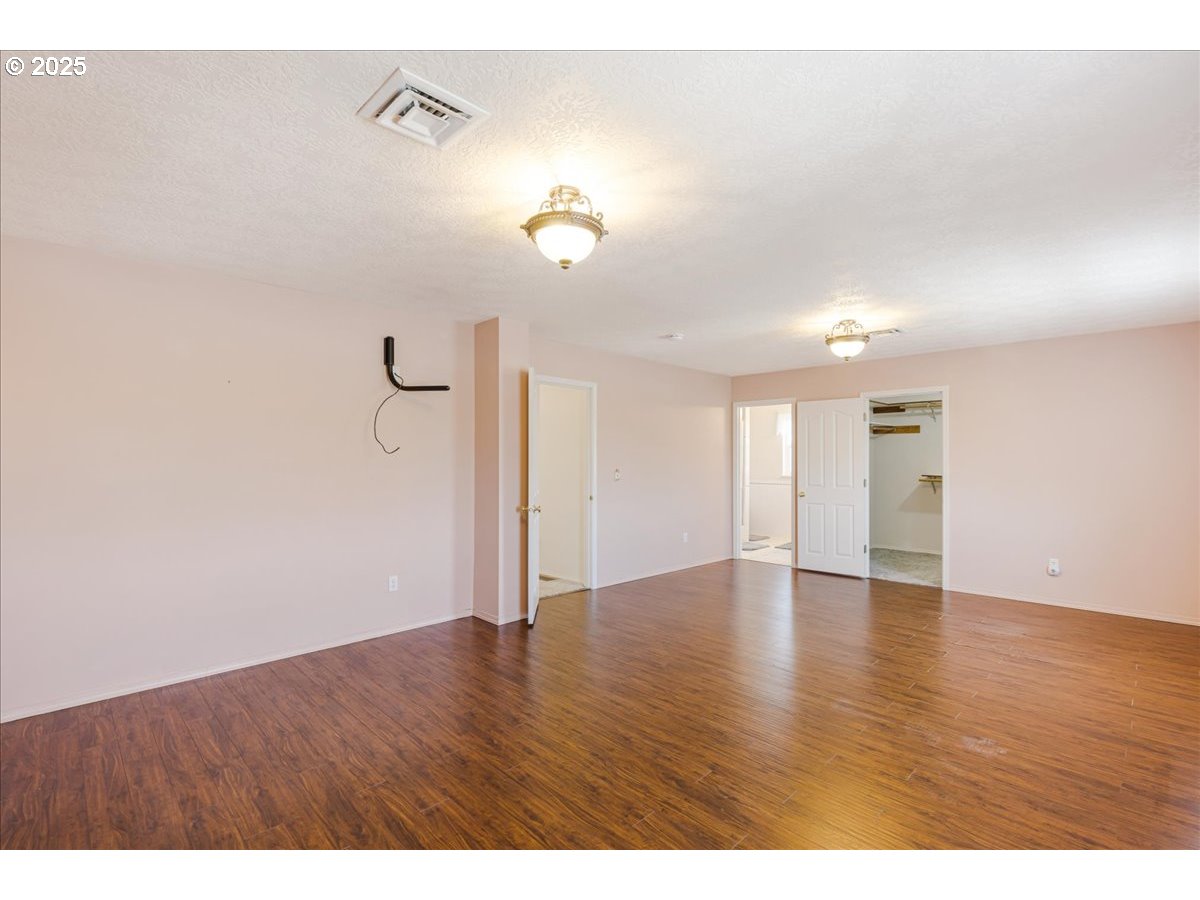 1825 Minnesota Street The Dalles, OR 97058 - Photo 28 of 47 a view of an empty room with wooden floor