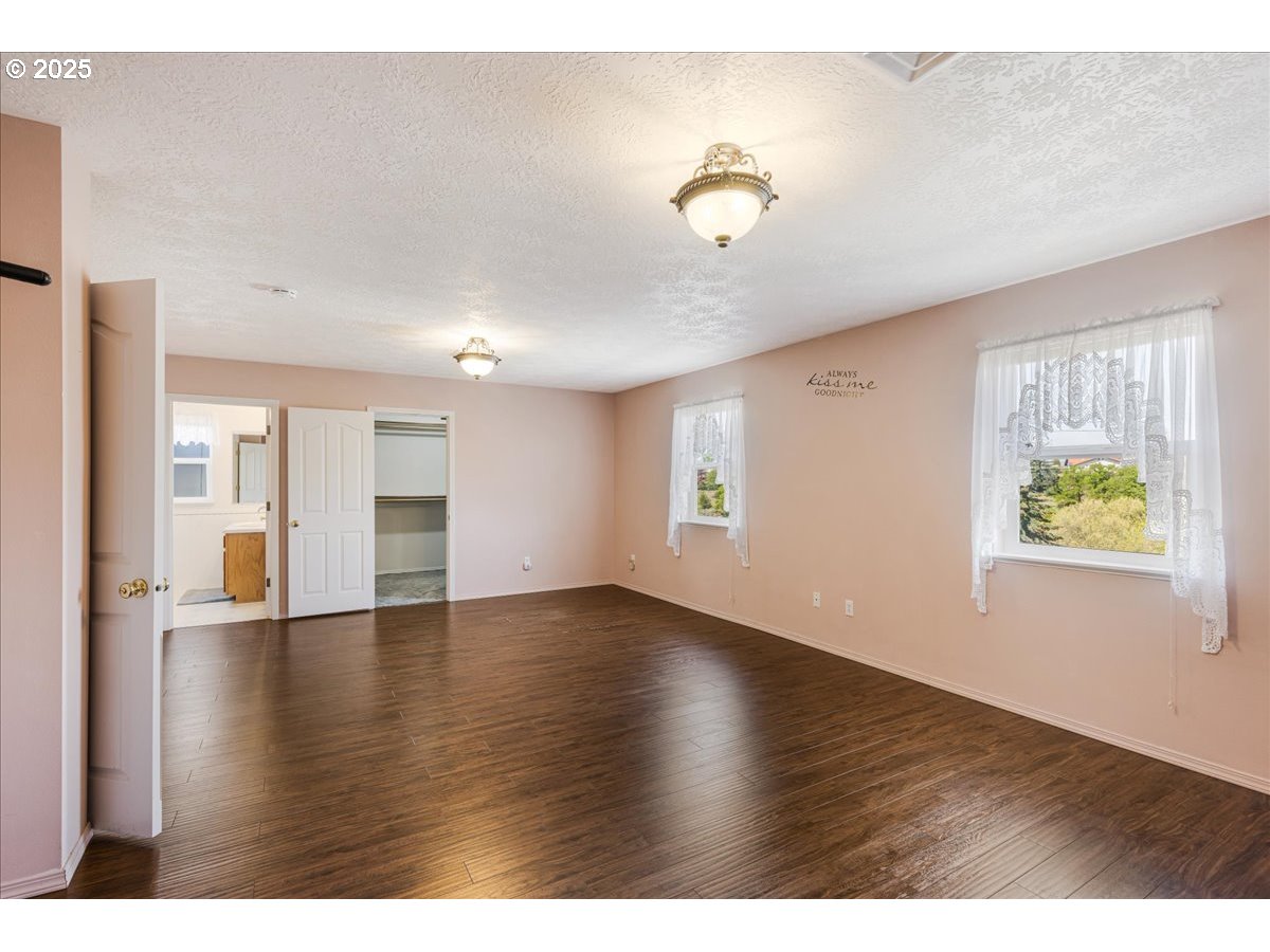 1825 Minnesota Street The Dalles, OR 97058 - Photo 29 of 47 a view of an empty room with window and wooden floor