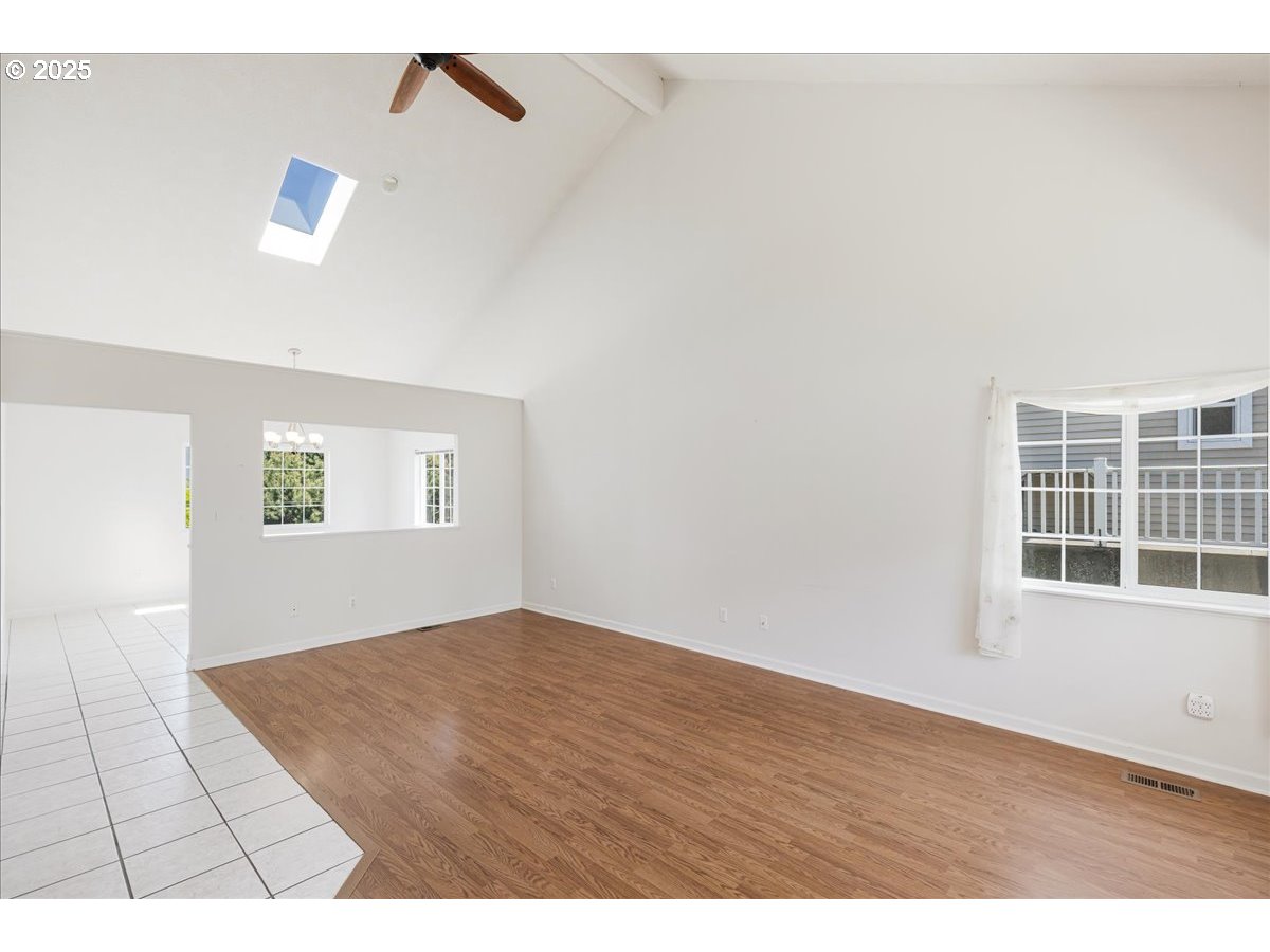 1825 Minnesota Street The Dalles, OR 97058 - Photo 3 of 47 a view of an empty room with wooden floor and a window