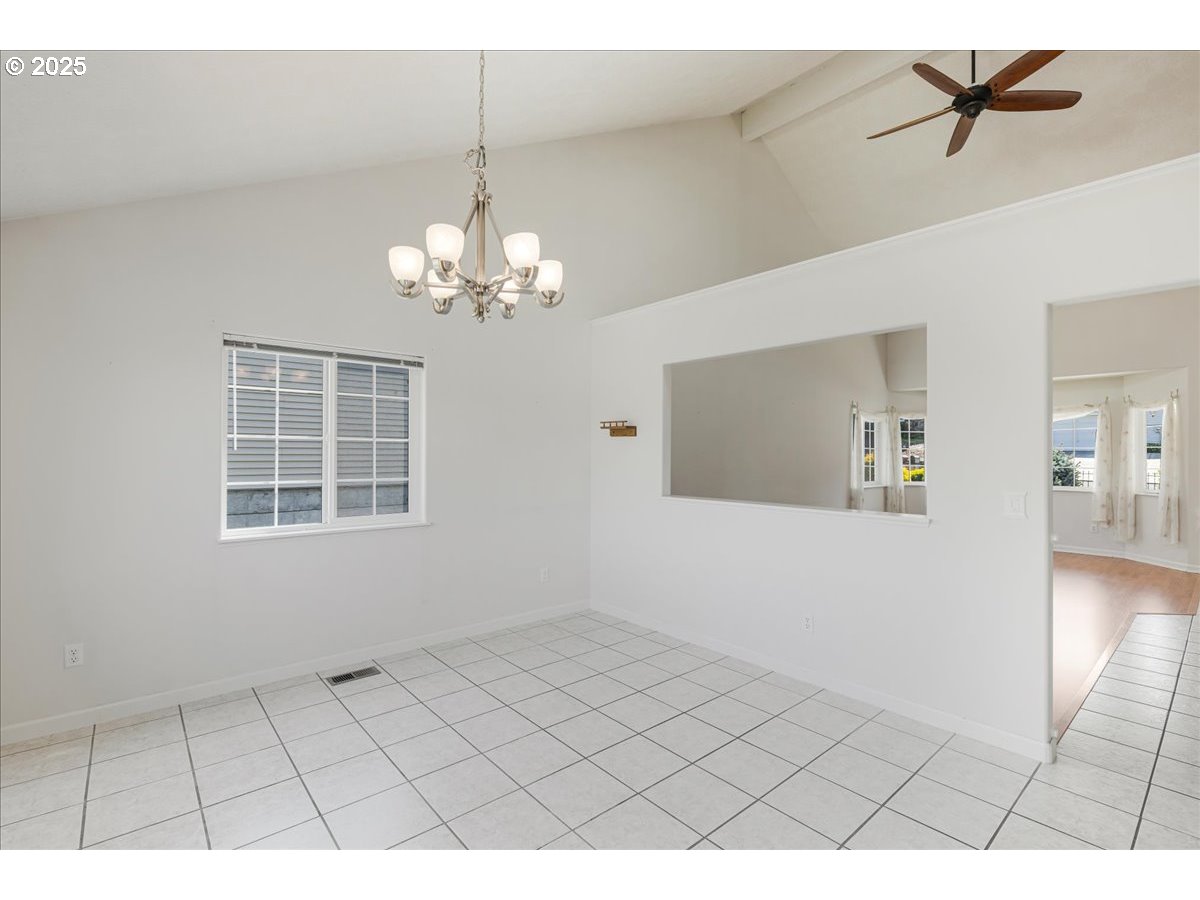 1825 Minnesota Street The Dalles, OR 97058 - Photo 8 of 47 a view of an empty room with a window