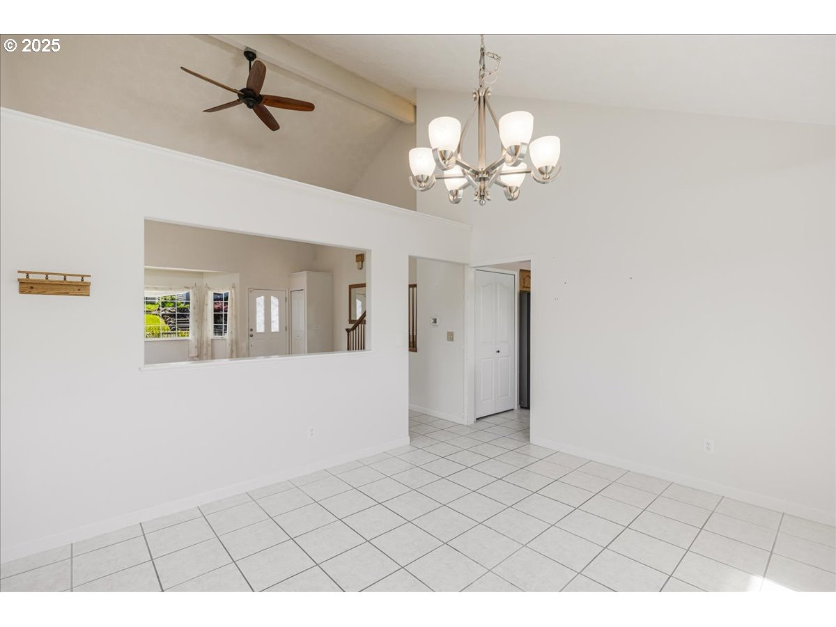 1825 Minnesota Street The Dalles, OR 97058 - Photo 9 of 47 a view of livingroom with chandelier fan and kitchen view