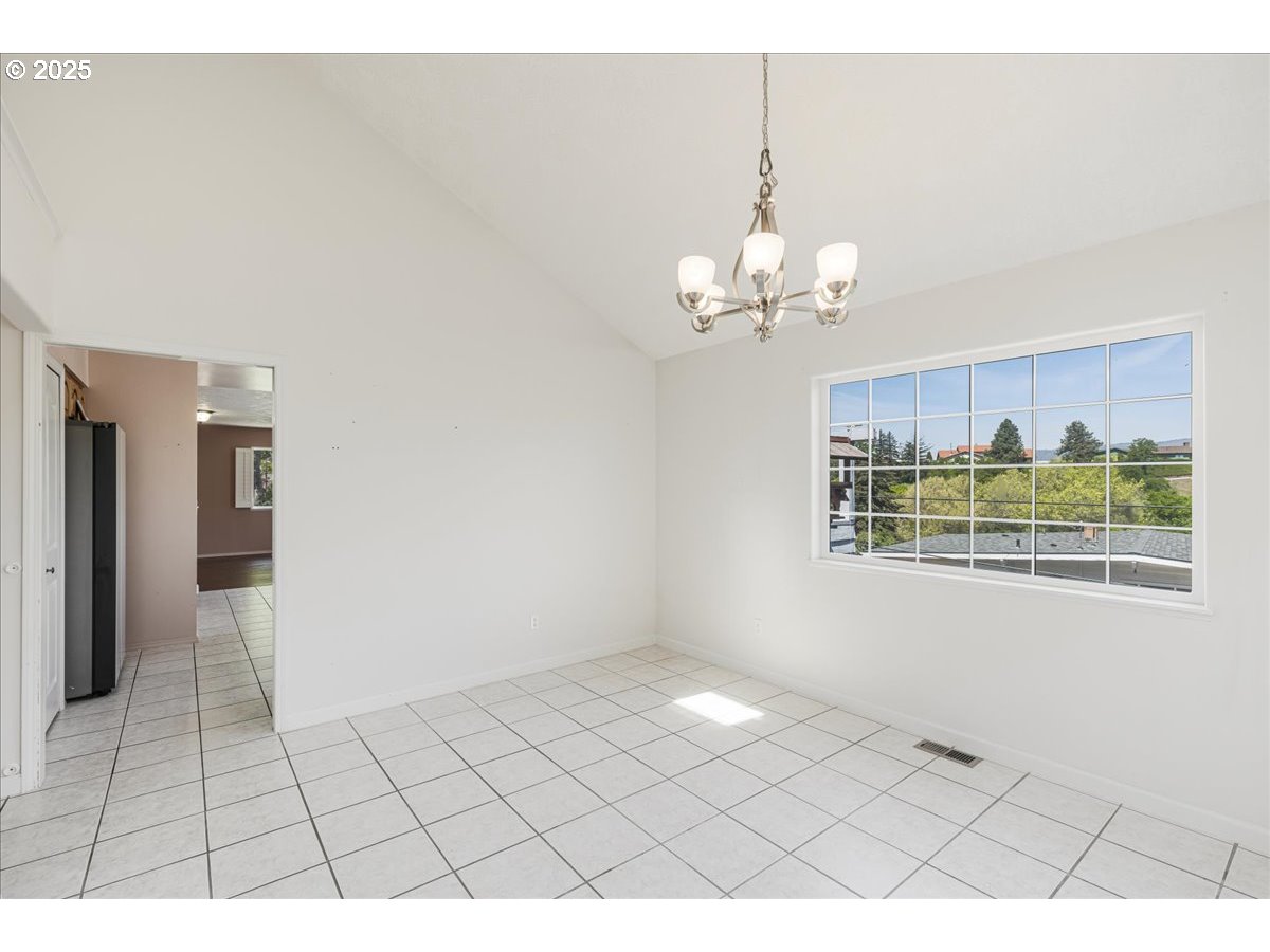 1825 Minnesota Street The Dalles, OR 97058 - Photo 10 of 47 a view of an empty room with a window