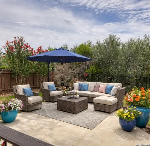a view of a patio with couches and potted plants