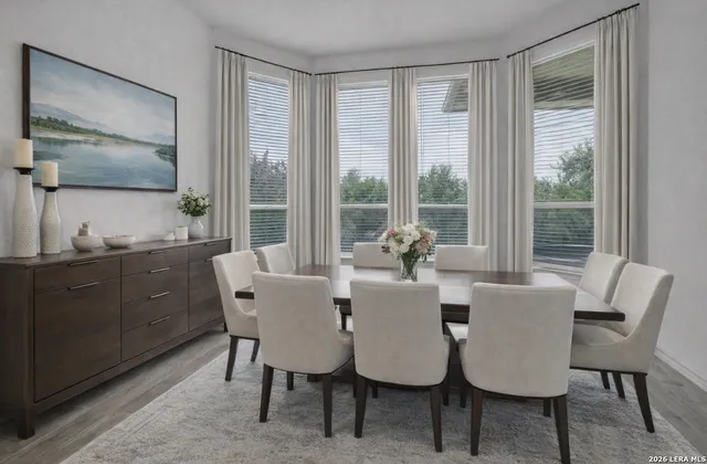 a view of a dining room with furniture window and outside view