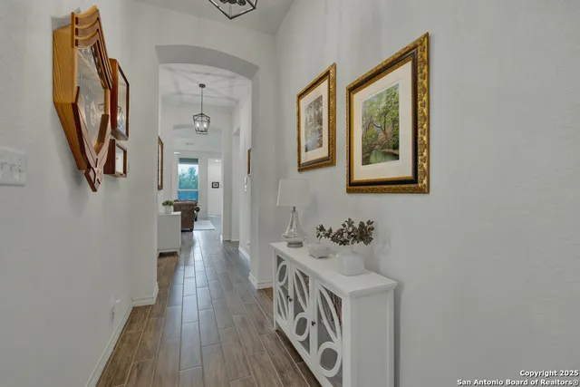 a bathroom with a sink a mirror and a window
