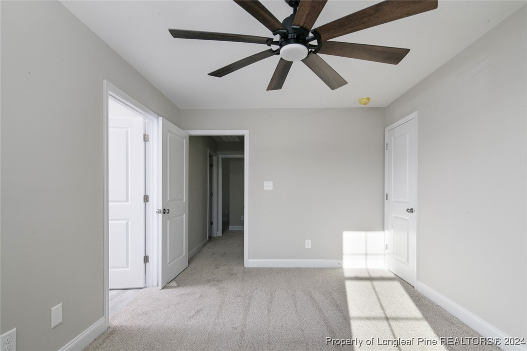 57 3rd Street Parkton, NC 28371 - Photo 17 of 24 a view of a livingroom with a ceiling fan and window