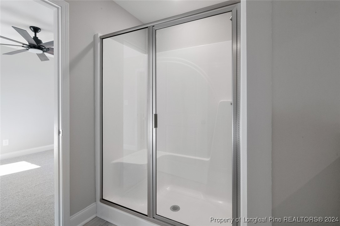 57 3rd Street Parkton, NC 28371 - Photo 19 of 24 a bathroom with a glass shower door