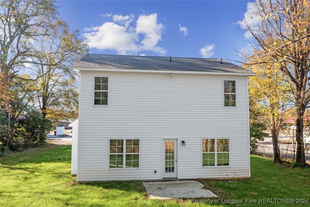 57 3rd Street Parkton, NC 28371 - Photo 21 of 24 a view of a house with a yard