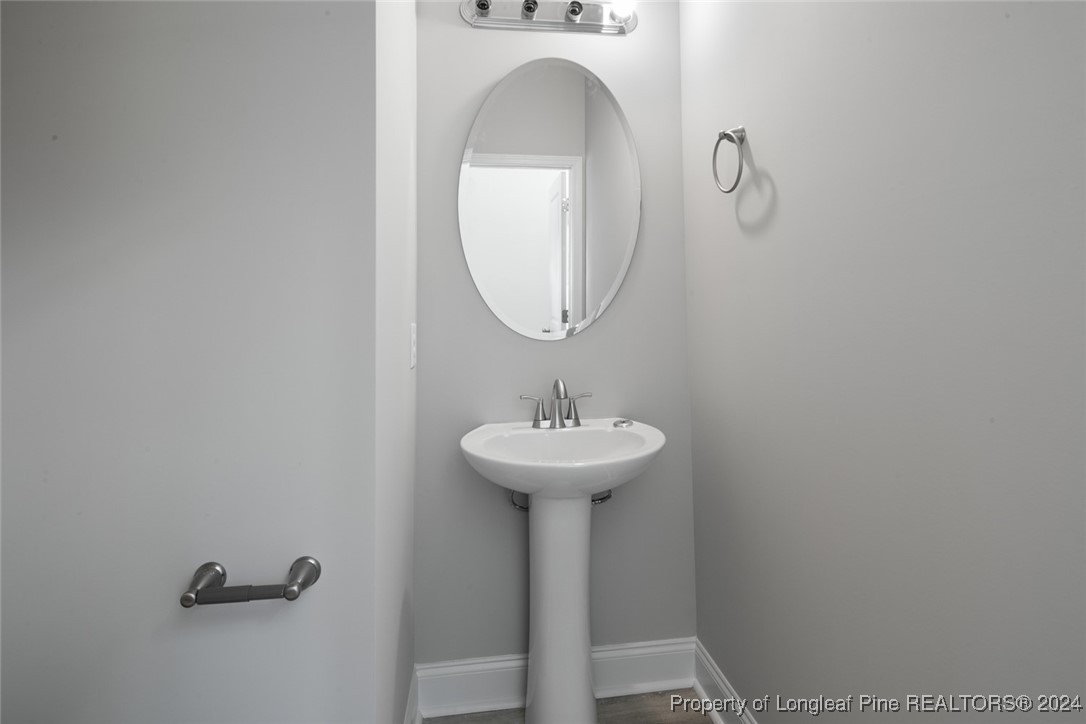57 3rd Street Parkton, NC 28371 - Photo 4 of 24 a bathroom with a sink and a mirror