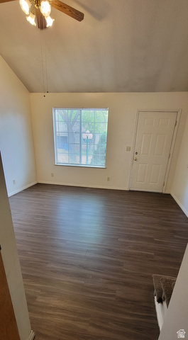 190 West 700 North Logan, UT 84321 - Photo 40 of 51 Unfurnished living room featuring dark wood-type flooring, lofted ceiling, and a ceiling fan