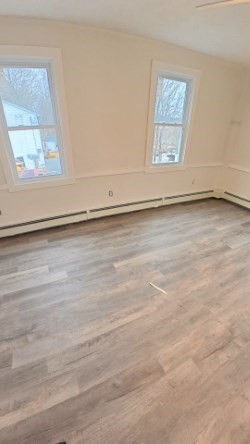 348 Main Street, Unit R Douglas, MA 01516 - Photo 4 of 9 a view of a room that has a window in it