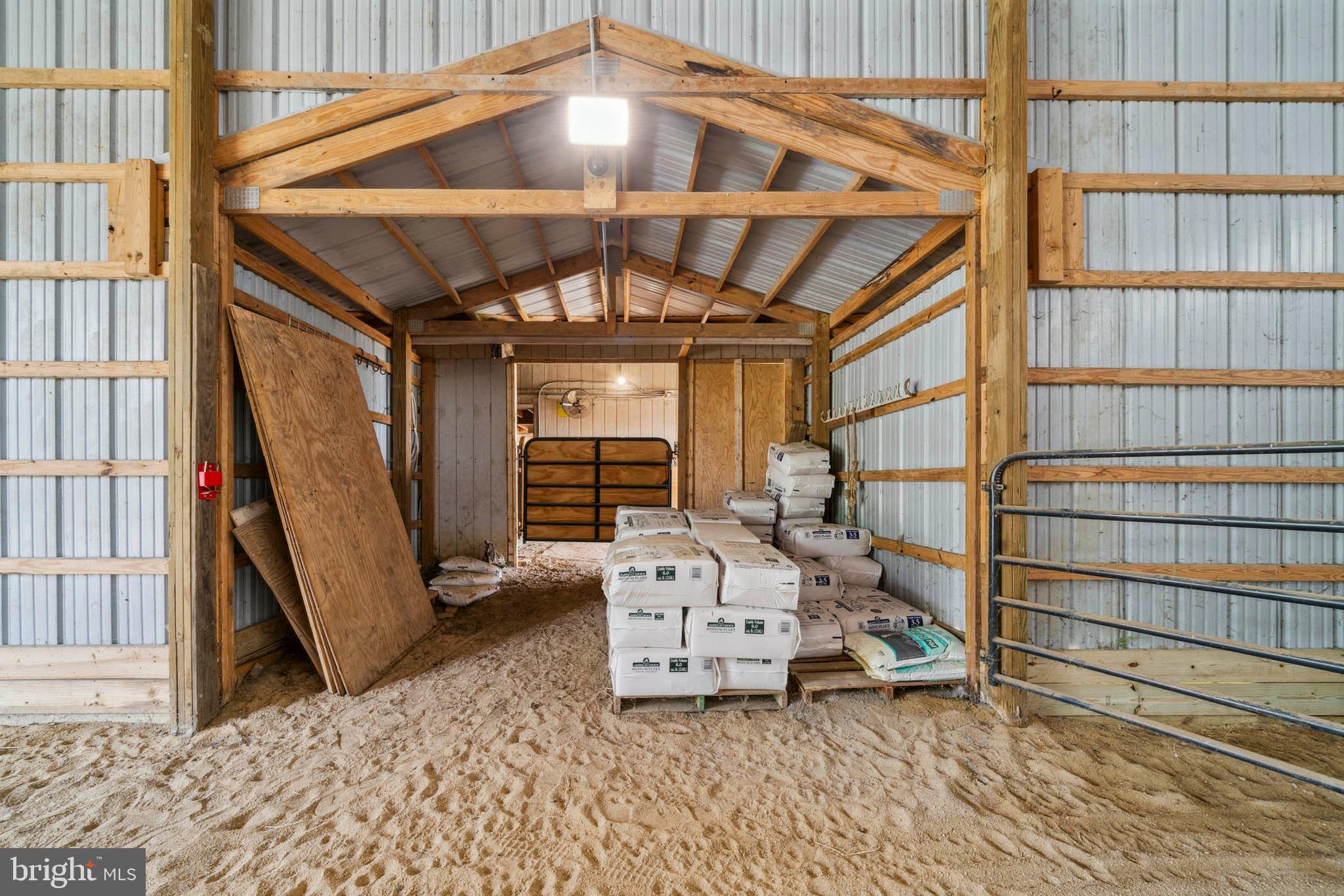 1392 Wakefield Valley Road New Windsor, MD 21776 - Photo 9 of 144 Breeze way connects to the center aisle barn