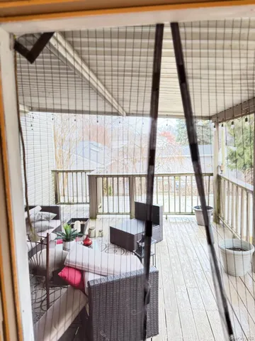 a view of deck with furniture and wooden floor