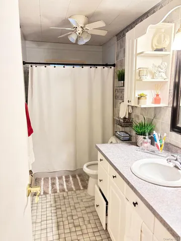 a bathroom with a sink a mirror and a shower