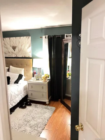 a bed room with a bed and a window