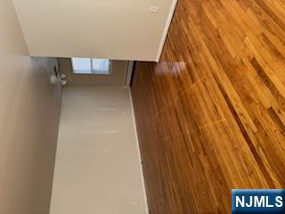 222 Garibaldi Avenue, Unit 47 Lodi, NJ 07644 - Photo 11 of 17 a view of empty room with wooden floor