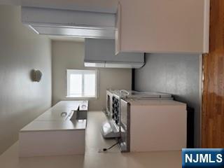 222 Garibaldi Avenue, Unit 47 Lodi, NJ 07644 - Photo 6 of 17 a kitchen with stainless steel appliances a refrigerator and a stove