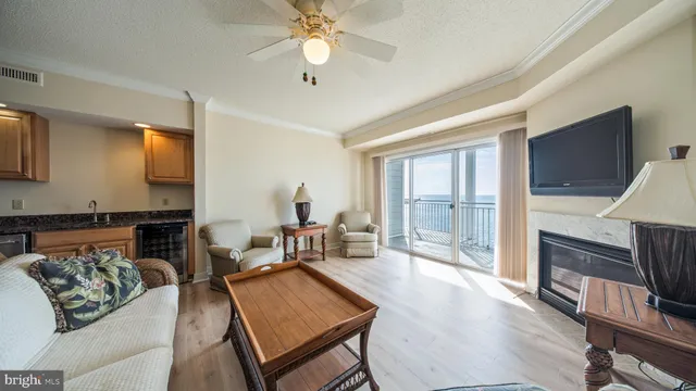 a living room with fireplace furniture and a flat screen tv