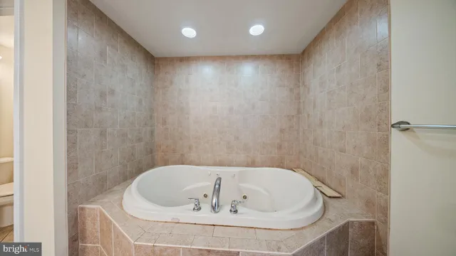 a bathroom with a bathtub and a sink