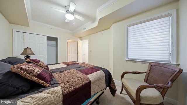 a bedroom with a bed and a closet