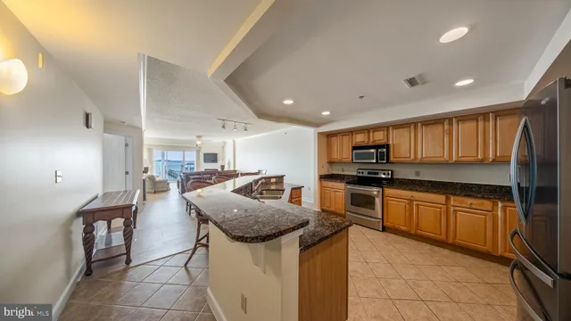 a dining room with furniture and a chandelier