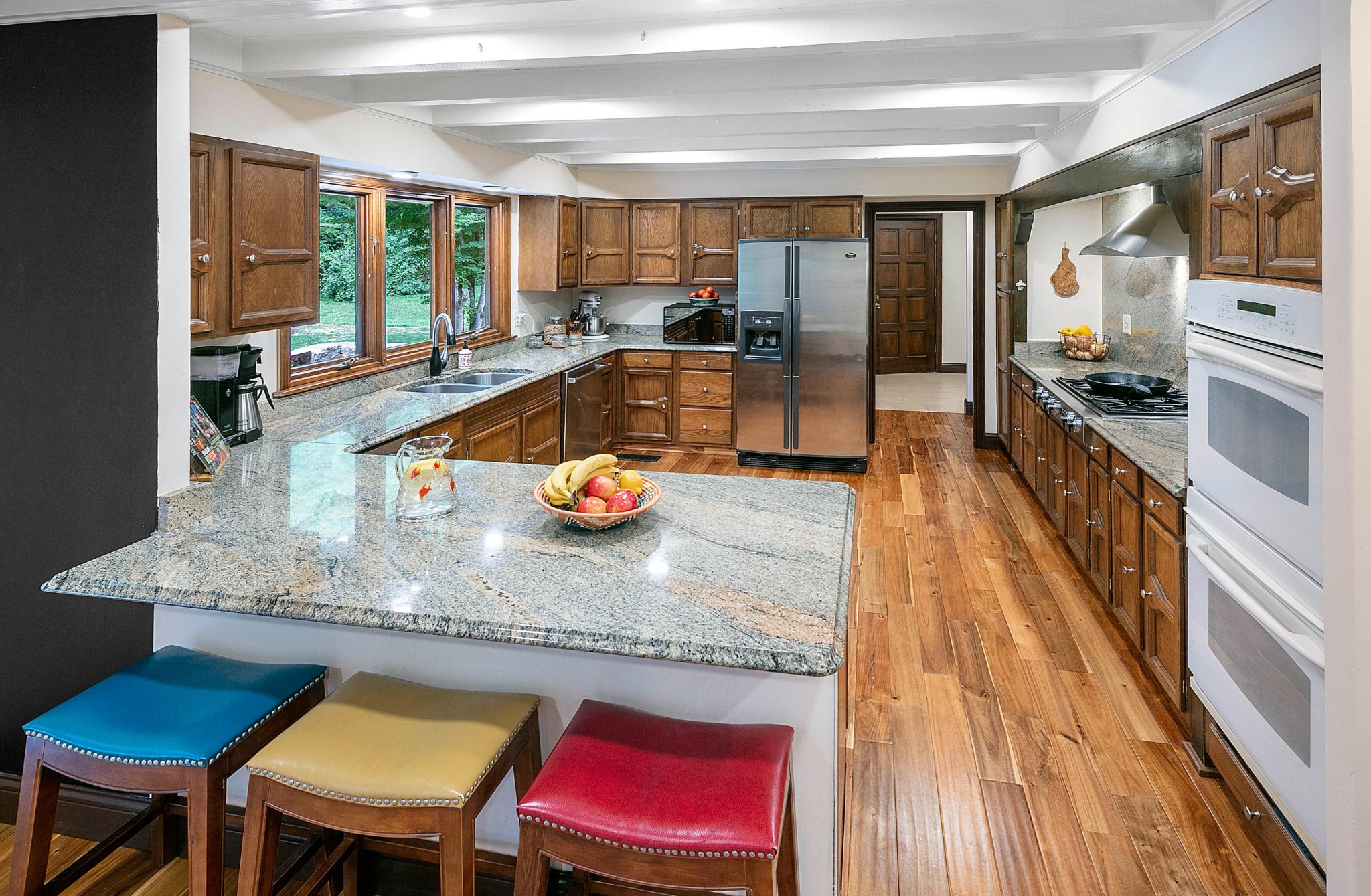 105 Balsam Road Oak Ridge, TN 37830 - Photo 8 of 40 a kitchen with stainless steel appliances granite countertop a stove a sink and a dining table