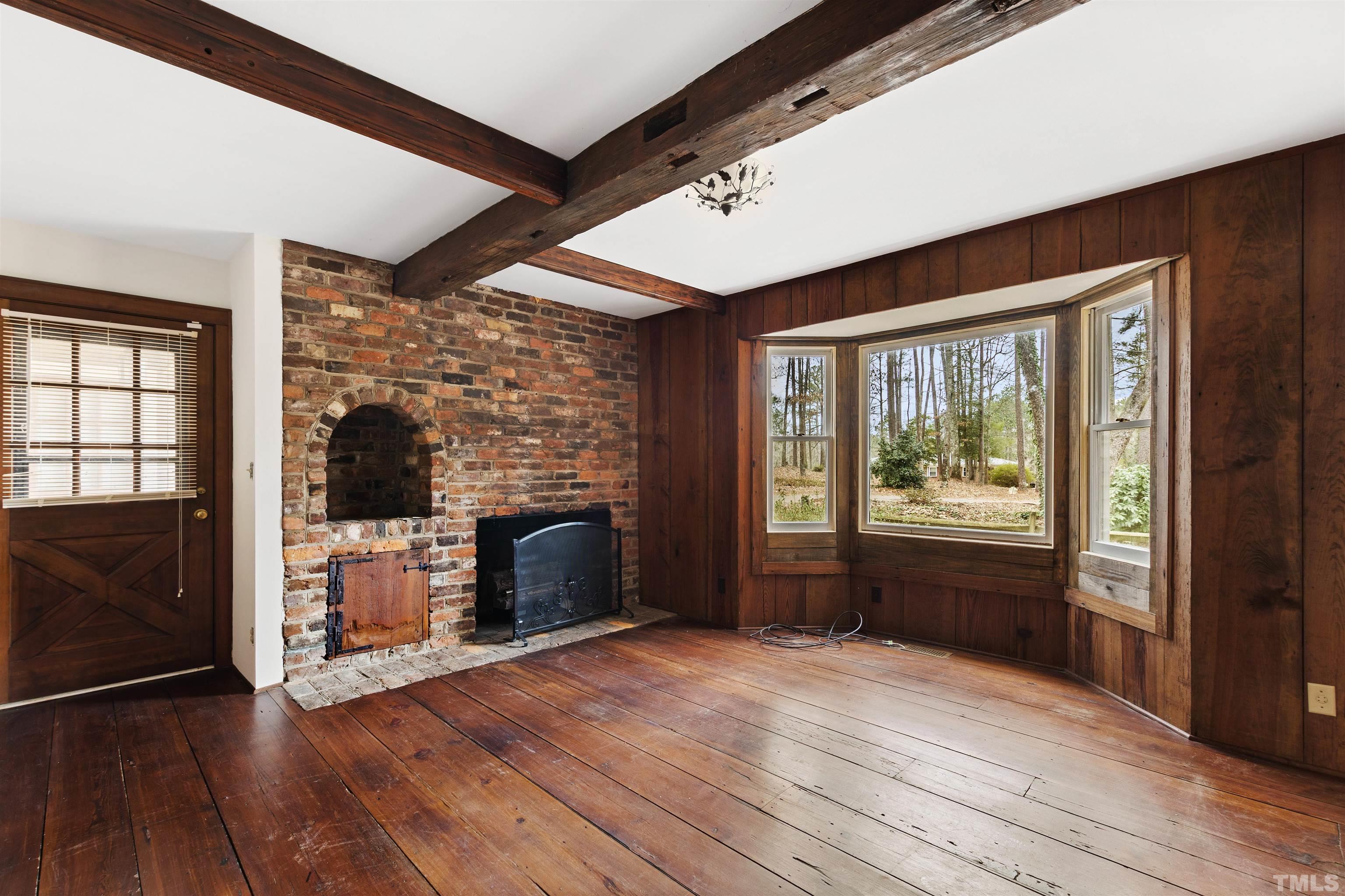 520 Old Stage Road Angier, NC 27501 - Photo 38 of 45 a empty room with a fireplace and wooden floor