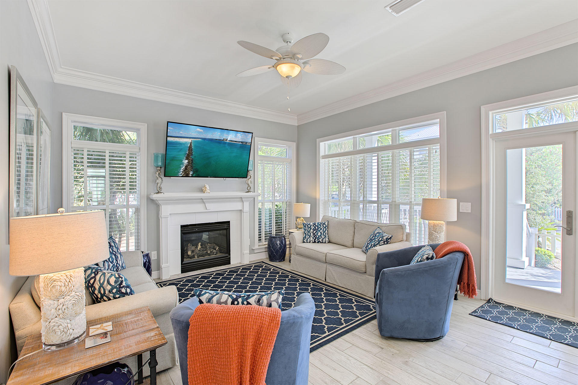 91 Old Beach Road Santa Rosa Beach, FL 32459 - Photo 8 of 25 a living room with furniture a fireplace and a flat screen tv