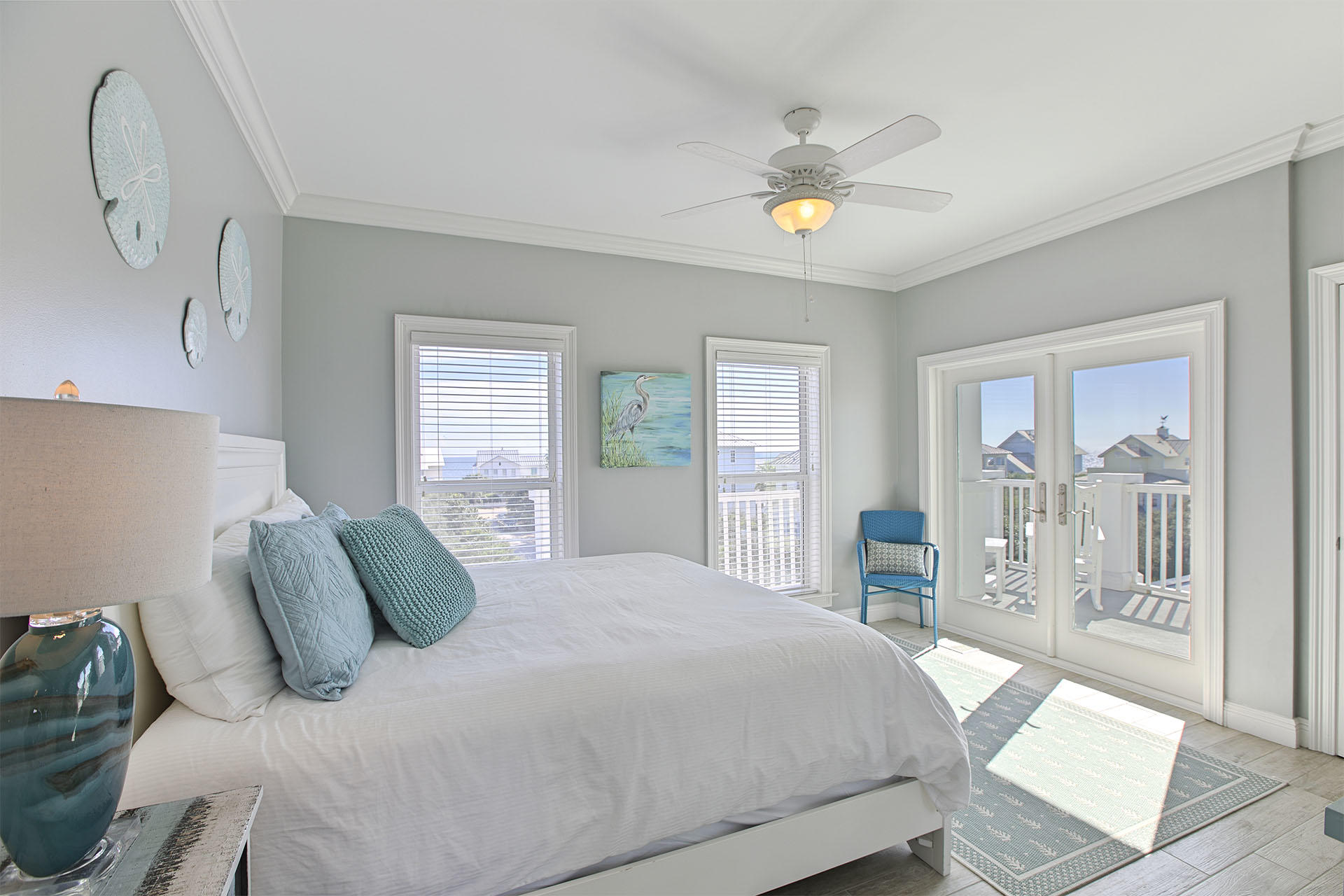 91 Old Beach Road Santa Rosa Beach, FL 32459 - Photo 10 of 25 a bedroom with a large bed and a chandelier