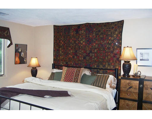 21 McCall Road Winchester, MA 01890 - Photo 8 of 14 a bedroom with a bed and wooden floor